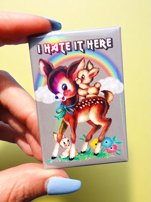 I Hate It Here Holographic Pin – Retro Rainbow Deer with Dark Humor